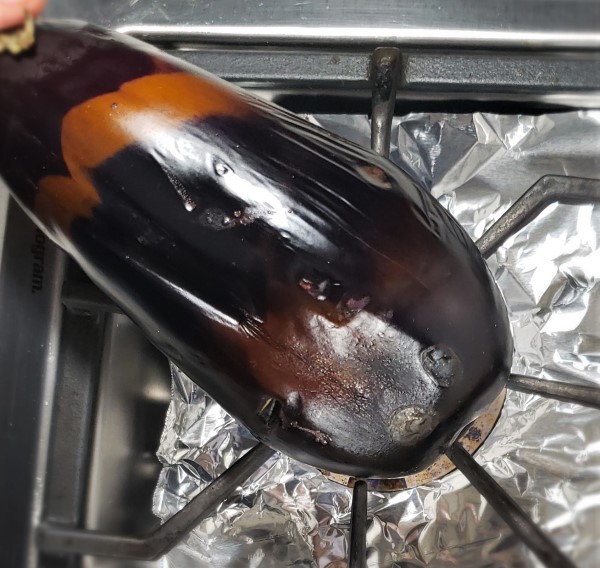 Roasting eggplant on a gas burning stove top